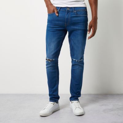 Mid blue ripped Sid skinny jeans